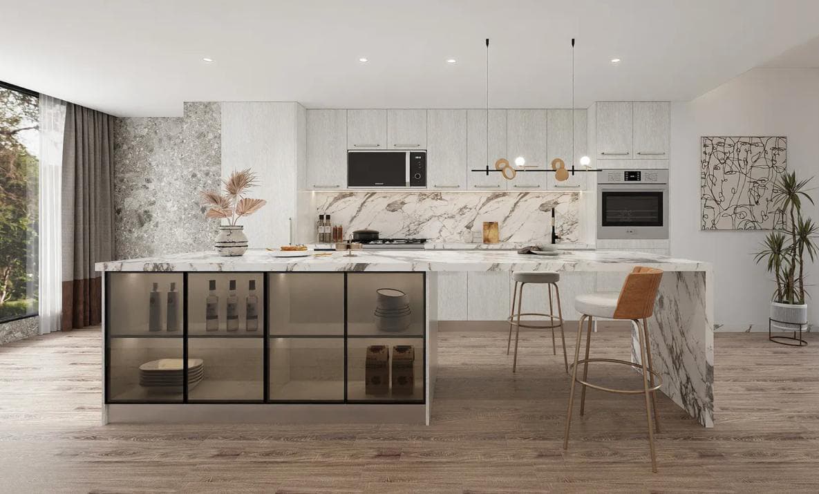 Modern white kitchen with a marble waterfall island and glass-front island cabinets